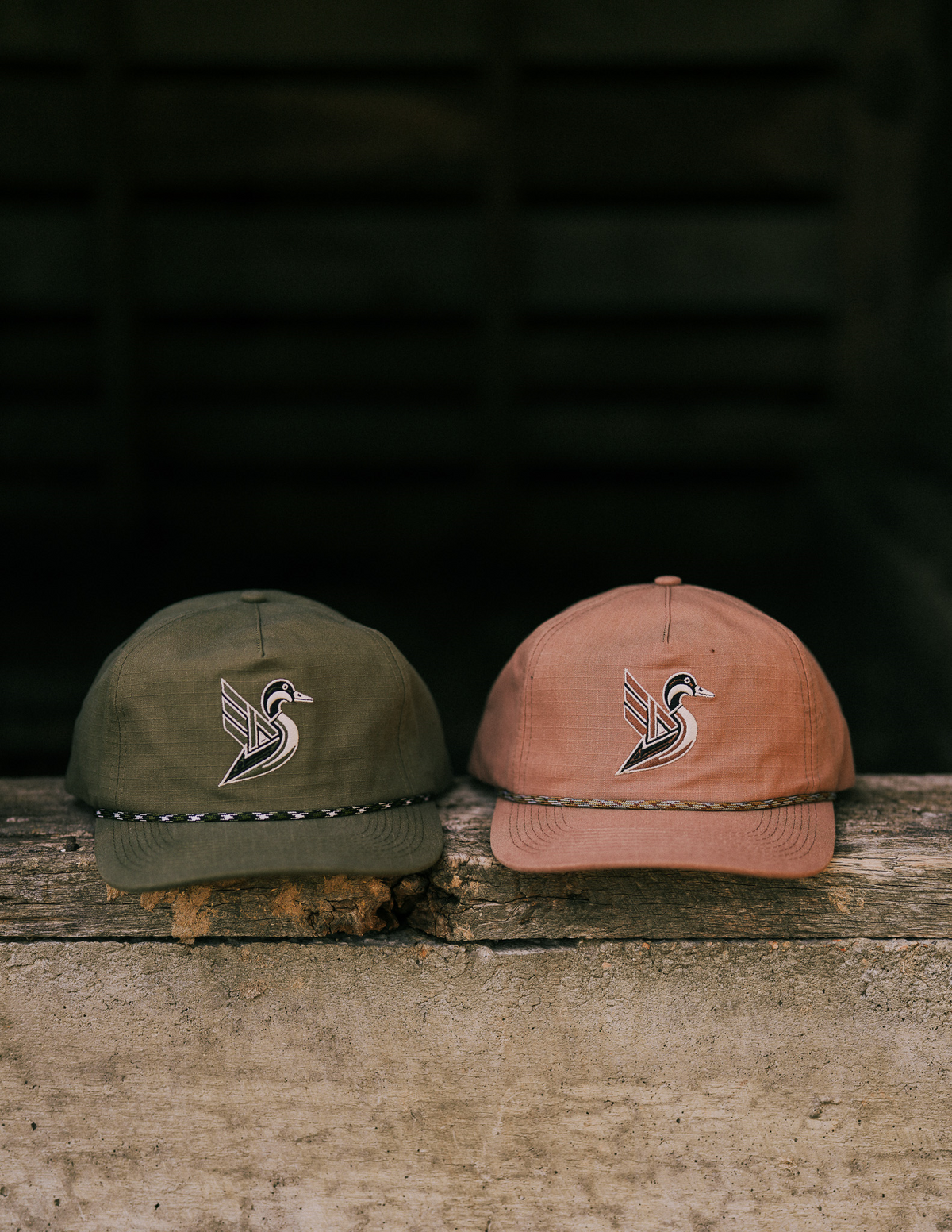 Rip-stop cotton hunting hats in Moss Green and Bayou Brown side by side, each with the Deco Duck and a rope band